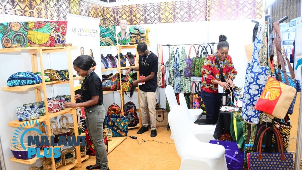 People arranging fabrics and accessories in a Malawian shop