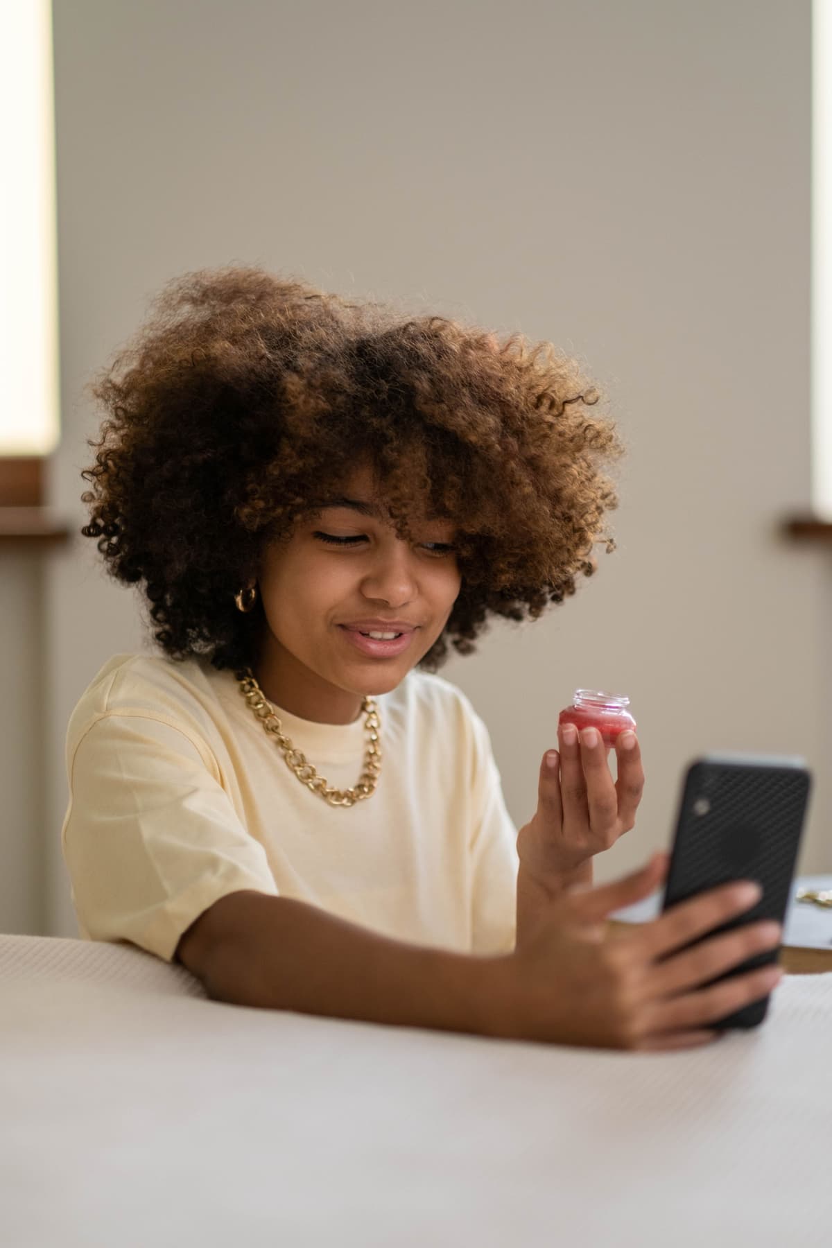 A creator sharing a product using her phone